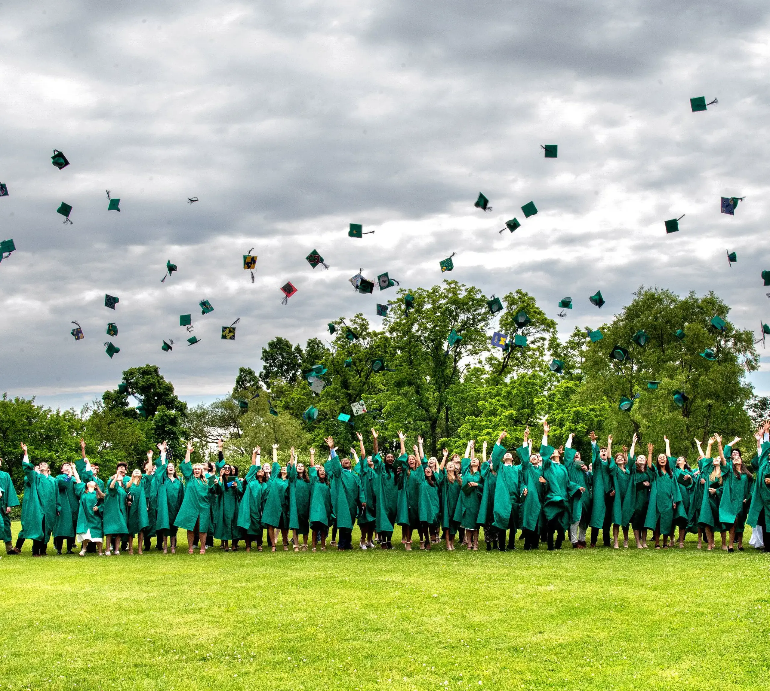 Students throwing graduation caps