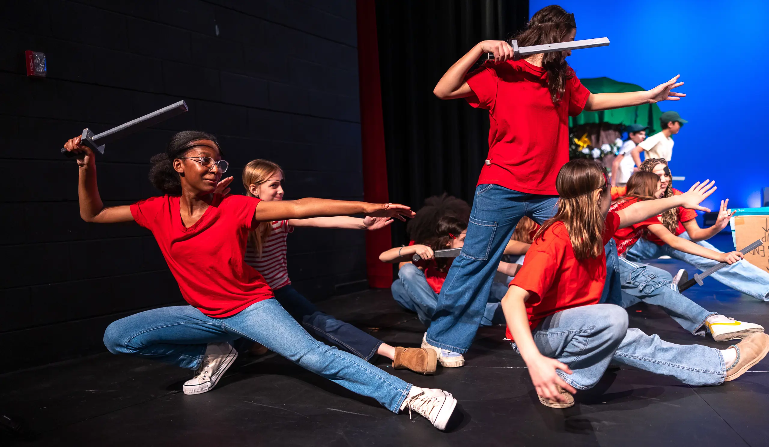 Middle schoolers on stage for a theater performance