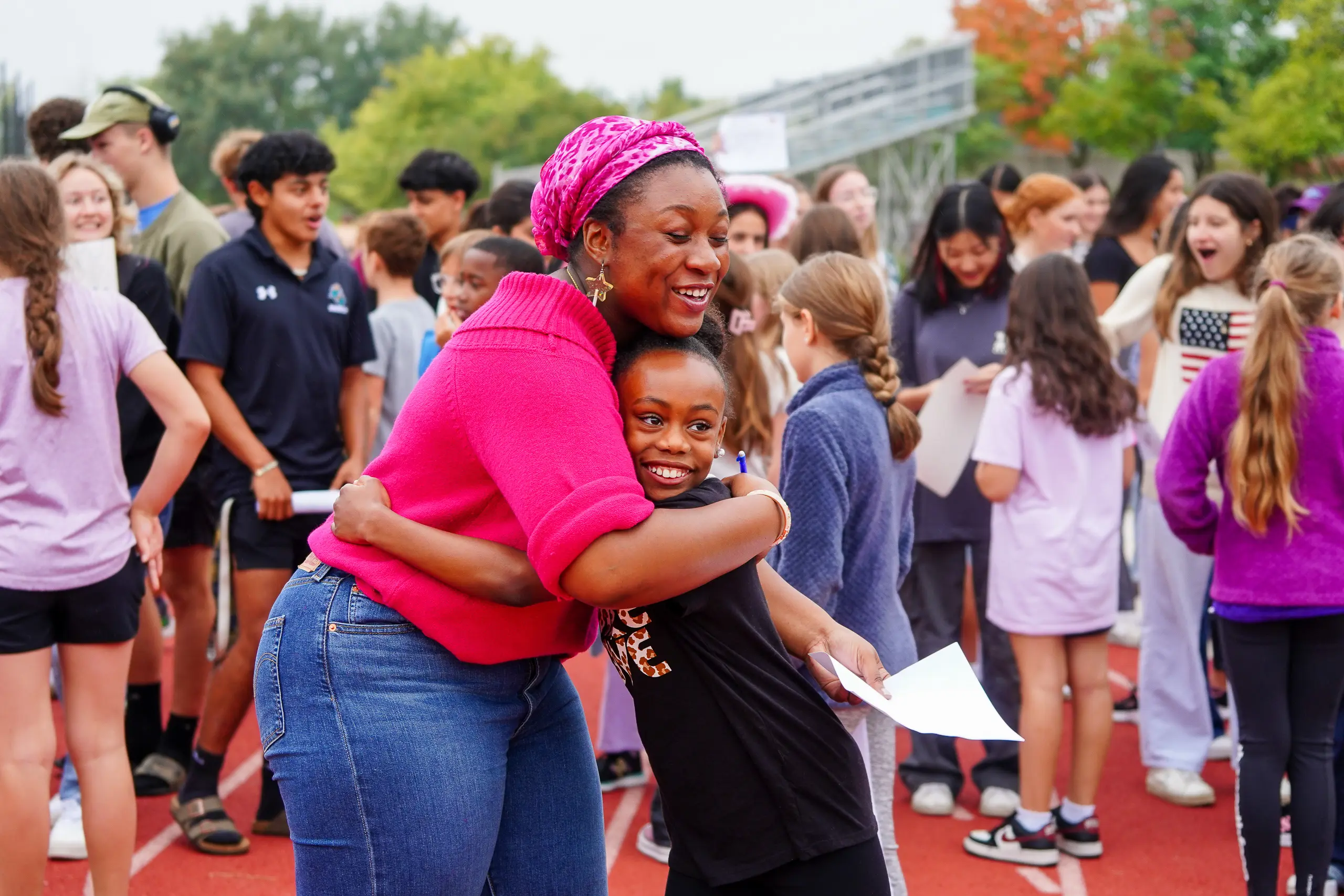 A senior meets their 6th grade buddy for the first time.