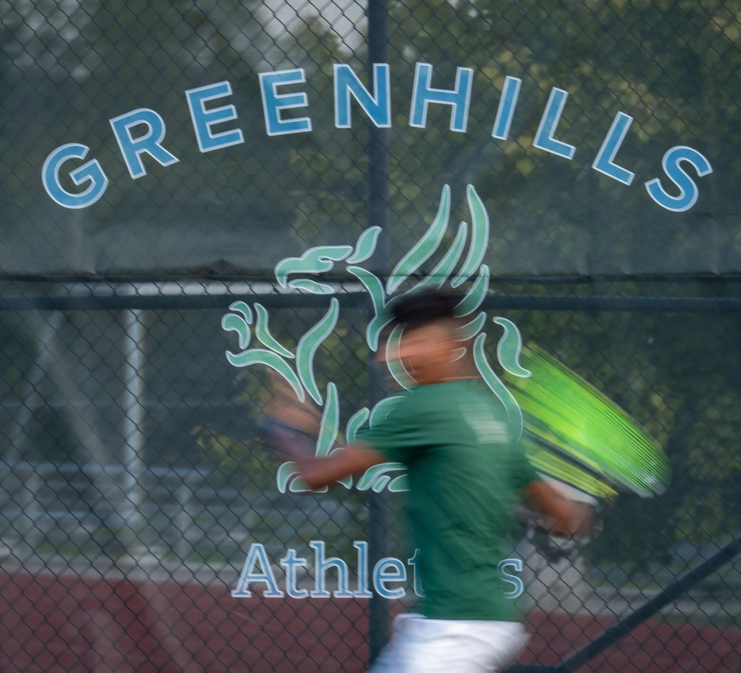 An action shot of a tennis player
