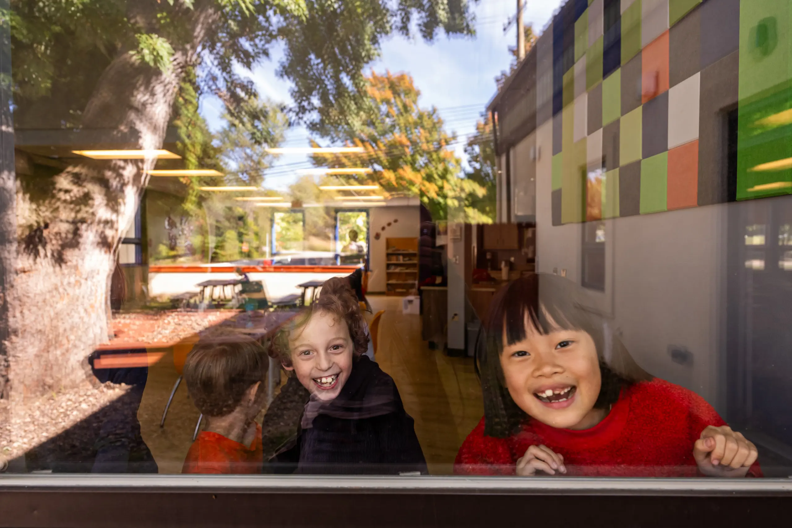Lower school smiles through the window